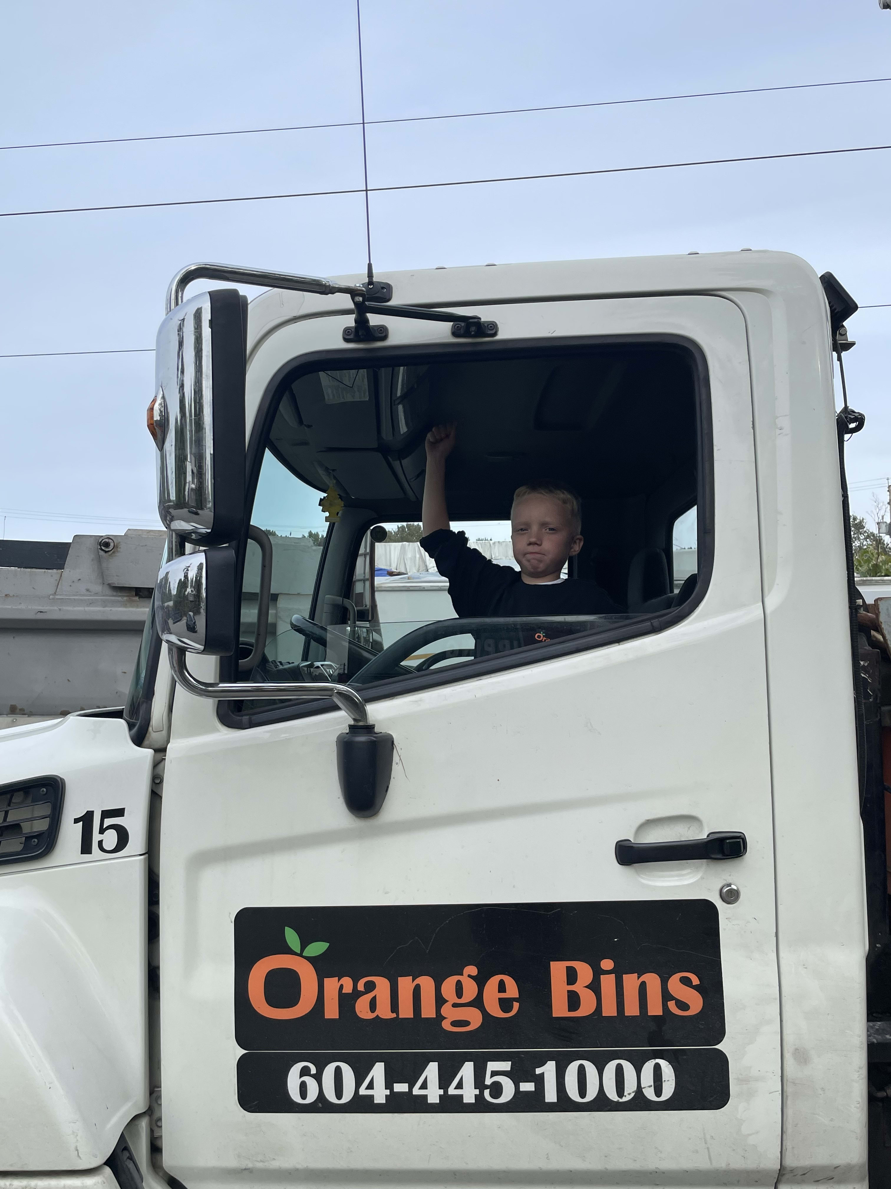 dumpster bin rental truck from Orange Bins